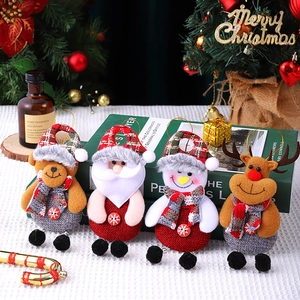 Christmas plush ornaments with Santa, snowman and reindeer on a festive background