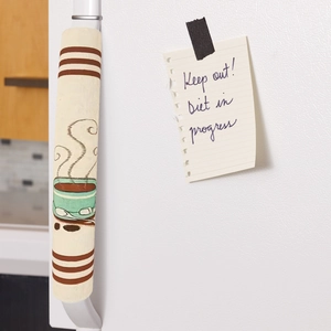 Detail of coffee linen refrigerator handle cover with rustic stripes and cup pattern