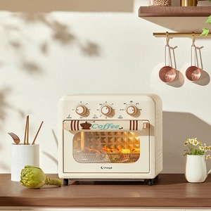 Retro cream oven with three knobs and decorative coffee linen handle covers in a kitchen