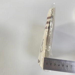 Detail view of linen refrigerator handle covers showing 25mm thickness with a ruler