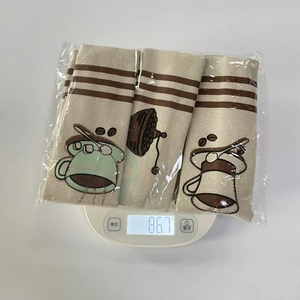 Weight measurement of three coffee themed linen appliance handle covers in packaging