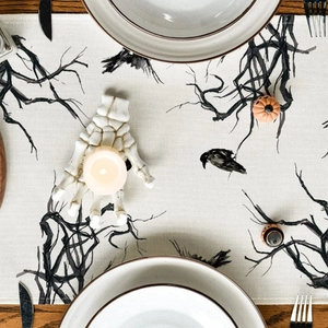 Halloween linen table runner with hand-drawn black crow and spooky tree branch patterns