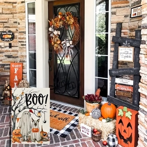 Halloween garden flag detail showing a cute ghost dog and pumpkin with BOO text design