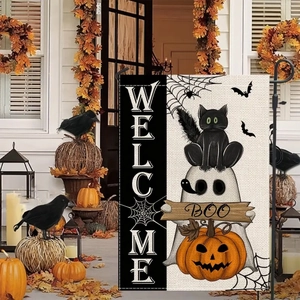 Halloween garden flag detail with cat, ghost, and pumpkin decor on a porch
