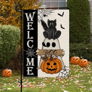 Detail of Halloween garden flag with ghost and cat motifs on outdoor metal stand