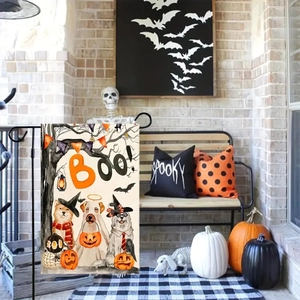 Halloween garden flag with cartoon dogs and pumpkin displayed on a porch