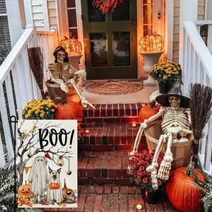 Outdoor Halloween garden flag with ghosts and pumpkins displayed on a festive porch