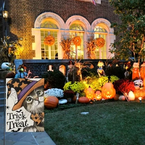 Halloween garden flag featuring a cat in wizard hat and Trick or Treat message in a yard