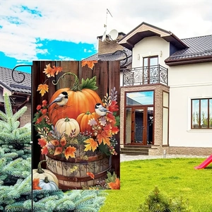Detail of double-sided linen garden flag with autumn pumpkins and maple leaf print