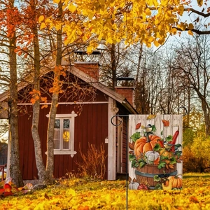 Outdoor view of double-sided linen garden flag with pumpkins and autumn leaves