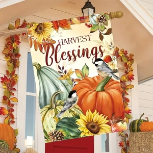 Detail of Harvest Blessings garden flag with pumpkins and sunflowers on white porch