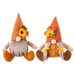 Set of male and female autumn harvest gnomes with sunflowers and maple leaves on hats