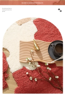 Detail of plush shaggy rug with warm red and ivory patchwork on light wood floor