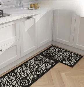 Close-up of woven kitchen mat with vintage circular pattern on wooden floor