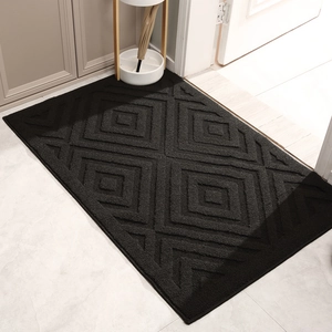 Durable black polypropylene entryway mat with geometric diamond pattern for home entrance