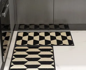 Detail of Nordic kitchen mat with beige and black geometric hexagonal patterns