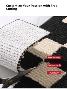 Close-up of cutting the black and white checkered non-slip tufted kitchen mat