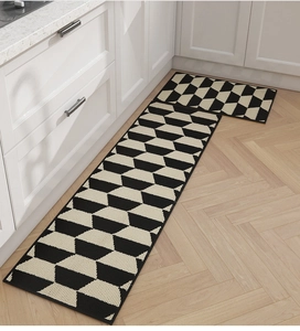 Detail of 2-piece Nordic kitchen mat set with 3D geometric honeycomb pattern on wood floor