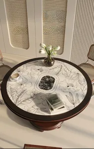 Waterproof leather placemat with floral print on a round wooden dining table