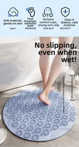 Detail of blue diatomaceous bath mat with massage texture and non-slip suction cups