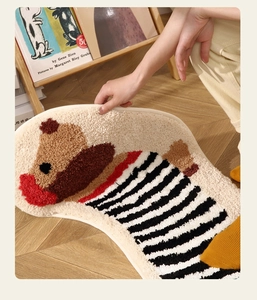 Detailed view of the soft tufted striped dog rug showing its thickness and plush texture