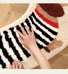 Close-up of thick plush striped puppy rug showing soft texture and premium hand feel
