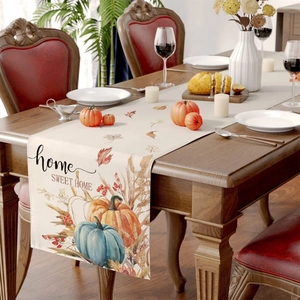 Detail of autumn table runner featuring colorful pumpkins and home sweet home text