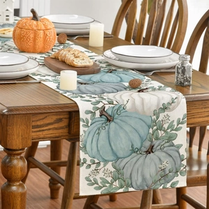 Linen table runner with pumpkin and eucalyptus print for fall dining room decor