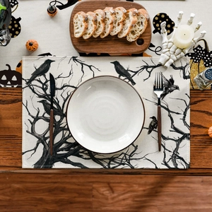 Macro detail of Thanksgiving linen placemat with black crow and dry tree printing