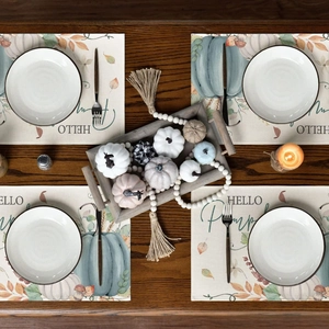 Set of four Thanksgiving table mats with HELLO Pumpkin print on rustic fabric