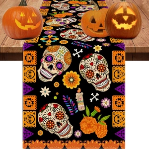 Halloween Day of the Dead table runner with sugar skull and marigold prints on black fabric