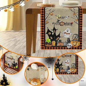 Detail of Halloween table runner with pumpkins, ghosts and castle prints on linen fabric