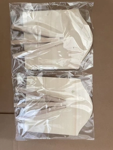 Detail view of DIY unfinished wooden gingerbread man fan kits in clear packaging