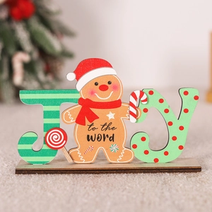 Macro detail of wooden JOY sign featuring a gingerbread man with festive holiday patterns