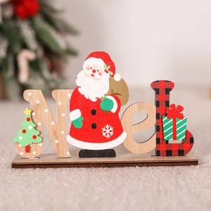 Detail of wooden Noel sign with Santa Claus figurine and red plaid pattern decoration