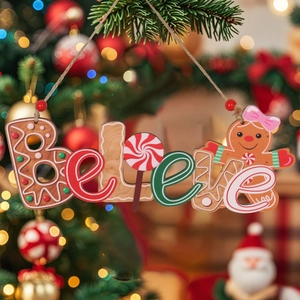 Wooden Believe Christmas ornament with gingerbread man design hanging on a festive tree