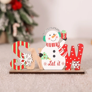 Close-up of wooden SNOW letter sign with a snowman and festive Christmas patterns