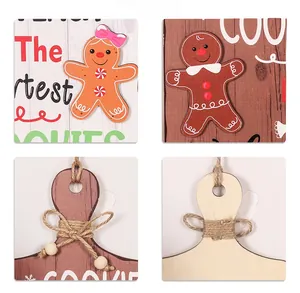 Detailed close-up of wooden gingerbread man ornaments with jute rope and beads