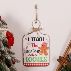 Close-up of wooden teacher gingerbread door sign with festive ribbon and hanging rope