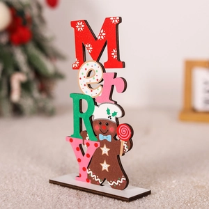Detail of wooden Merry Christmas table sign featuring colorful letters and a gingerbread man