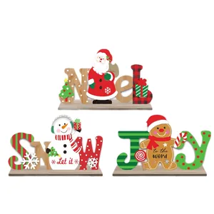 Three-piece set of wooden Christmas tabletop signs featuring Noel, Snow, and Joy designs