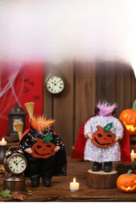 Halloween vampire dolls with sequined capes and pumpkin details on a vintage wood background