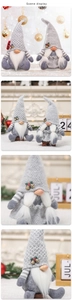 Detail shot of grey knitted Christmas gnomes with holiday bell and holly decorations