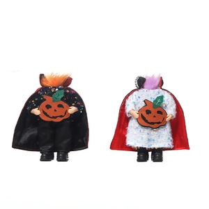 Two Halloween devil figurines with glitter outfits and pumpkin felt charms for holiday decor
