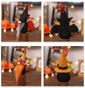 Detail of Halloween gnome plush dolls with bat wings and spider patterns for festive decor