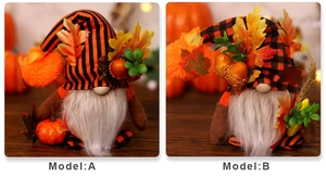 Detail view of two autumn gnomes with maple leaf decorations and harvest themed hats