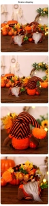 Detail of plush fall gnomes with maple leaves and acorns in warm festive scene