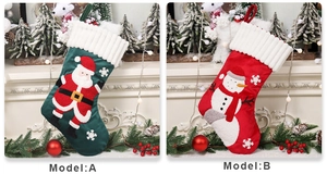 Detail of Christmas stockings with 3D Santa and snowman appliques on velvet fabric