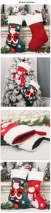 Detail of Christmas stocking fabric with 3D Santa embroidery and plush cuff accents