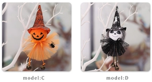 Detail of hanging Halloween ghost and pumpkin witch dolls with bells and mesh skirts